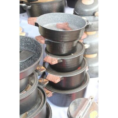 Black brick-pattern non-stick cookware set with granite interior